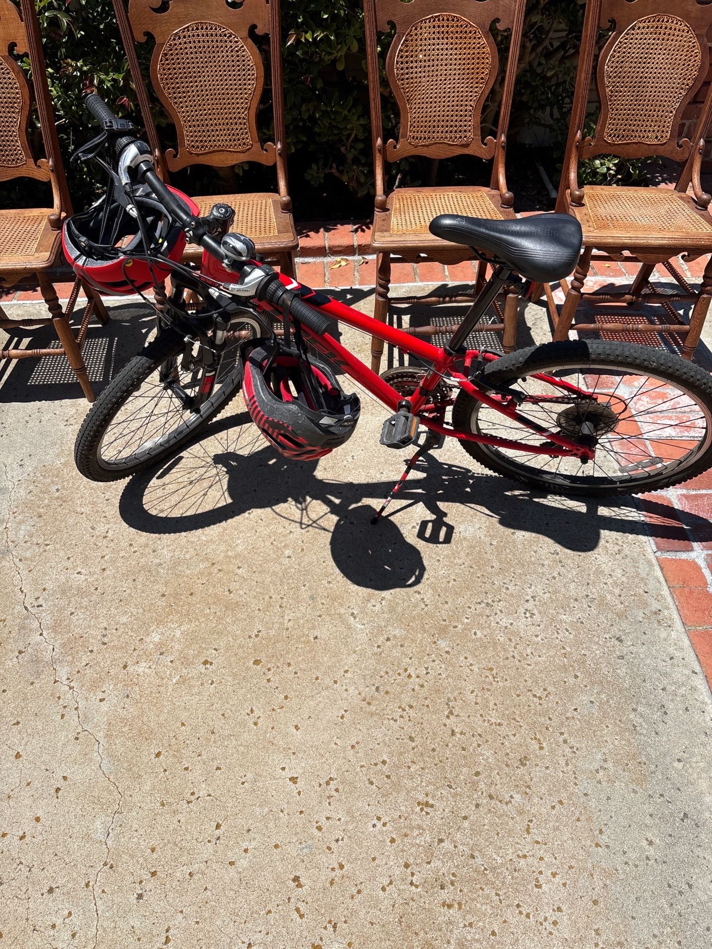 Red youth mountain bike with helmet