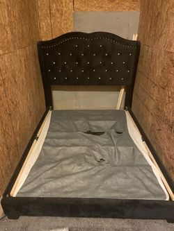 Black studded tufted bed frame