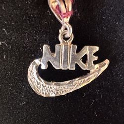 2 Silver Nike Branded Silver Pendants. $15/each