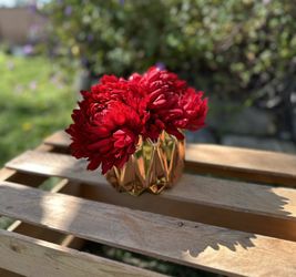 Red Flowers In A Gold/Bronze Vase