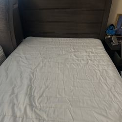 brown bed frame and mattress 