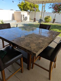Faux leather high dining table and chairs set.