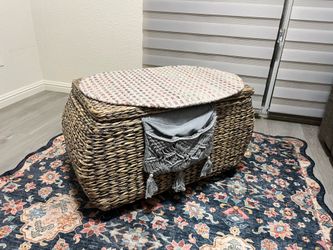 Wicker storage ottoman on wheels