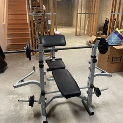 Weight Bench with Barbell and Weights