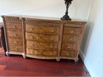 Raymour & Flanigan Wilshire bedroom dresser features a warm cherry finish and classic decorative