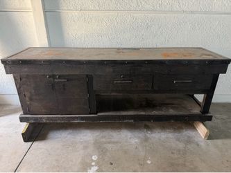 Steel topped wood workbench as shown Steel topped wood workbench as shown