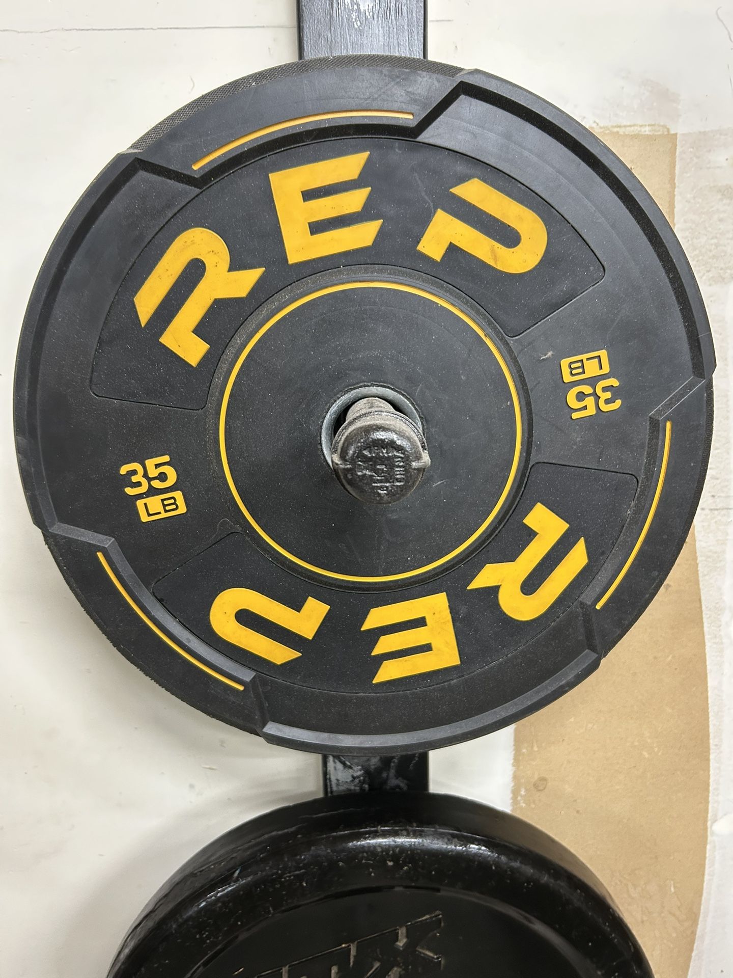 35 lb Olympic Plates, 40 lb Dumbbells, weight rack