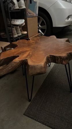 Solid wood table. Metal legs black in color
