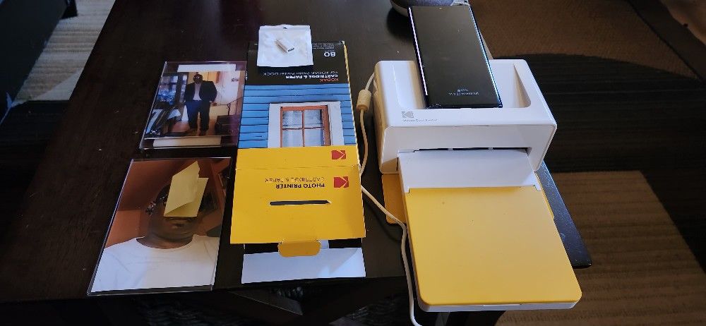 PRINT PICTURES DIRECTLY FROM YOUR PHONE WITH THE KODAK INSTANT 4PASS DOCK PRINTER.