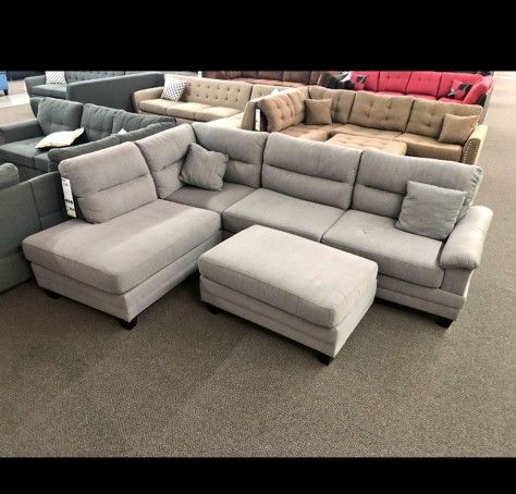 Light gray sectional with ottoman 