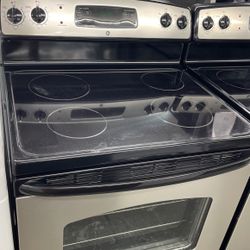 Used GE 4 Burner Glass Top Black And Stainless Steel Range. 1 Year Warranty 