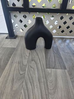 Matte black stoneware or ceramic flower vase