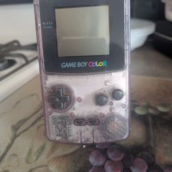 clear purple Nintendo Game Boy Color handheld console
The best I can tell you about this game boy console is that it does turn on with batteries but t