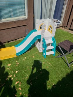 Toddler slide with goal on the back