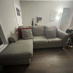 Beige couch with chaise, chair, and ottoman