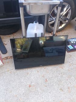 32-in Samsung Smart TV with wall mounts