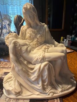 This is a statue of the Pietà (Italian for “pity” or “compassion Michelangelo