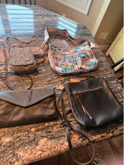 Lot of four ladies purses.