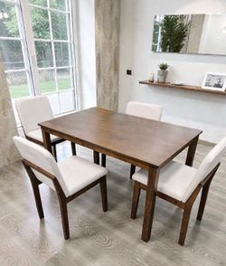 Brand new dining table with 4 chairs. Comes new in the box.
