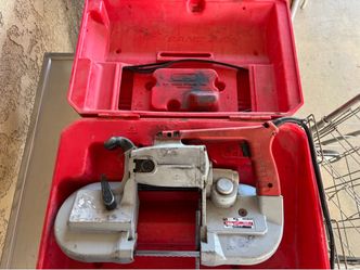 Milwaukee portable bandsaw with case and extra blades