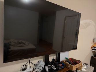 Smart TV  and stand with remote