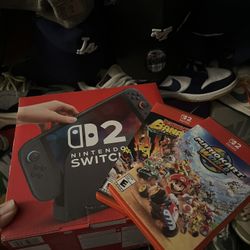 COMPLETE IN BOX SLIGHTLY USED NINTENDO SWITCH 2 WITH GAMES (DONKEY KONG BANANZA, MARIO KART WORLD)