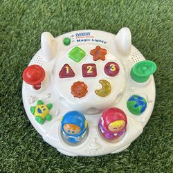 Vintage VTECH  Little Smart Magic Lights UFO is a developmental baby toy designed to encourage hand-eye coordination, language skills, memory, motor