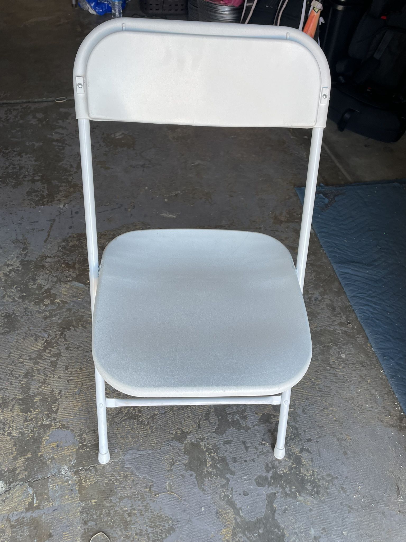 White Folding Chairs Up For Sale