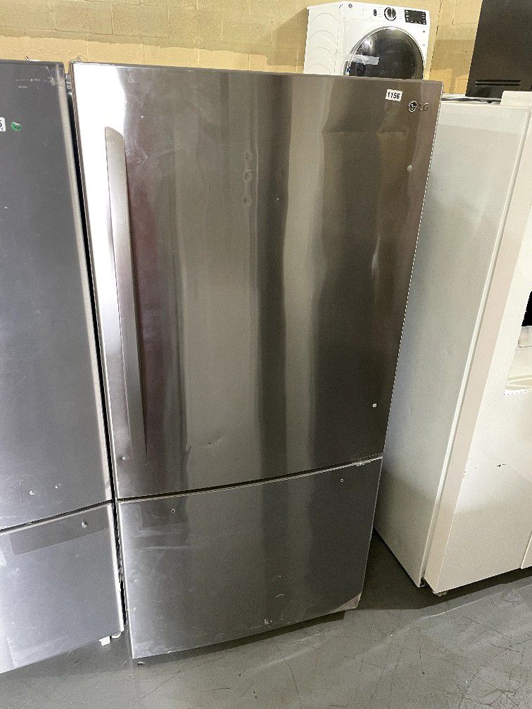 LG 33” Bottom freezer refrigerator NO HANDLES and DENTED $400