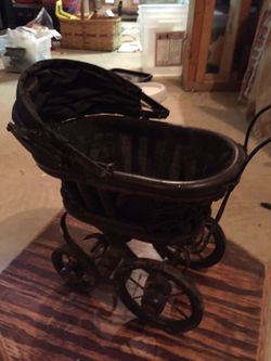 Very small baby carriage.
