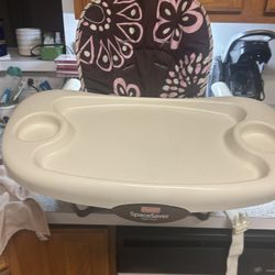 This is a Fisher-Price SpaceSaver High Chair. 