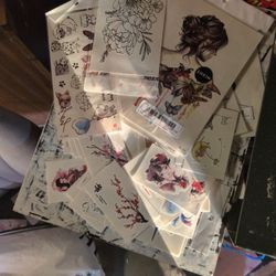 collection of temporary tattoo stickers, commonly sold in bulk or sets for body art applications. 