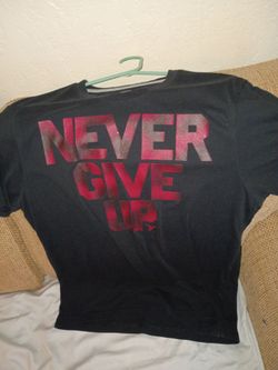 Ladies never give up shirt size medium cash only good condition