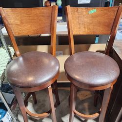 Pair of brown wood swivel stools with backs $35 ea
