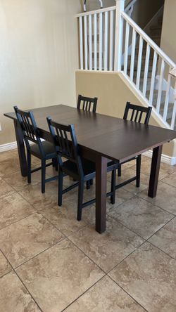 Brown wood dining table & 4 chairs