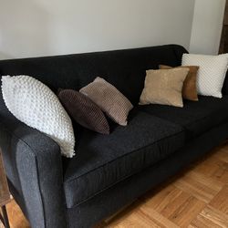 Black Sofa with White Pillows 