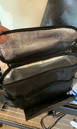 Travel bag hangs over seat