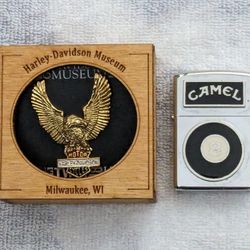 Harley Davidson Museum Wings Along With Eight Ball Zippo Lighter.