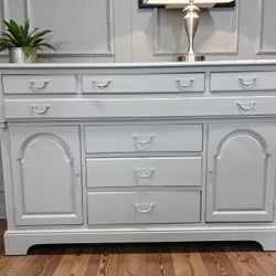 Buffet/sideboard/TV console custom painted in light gray. Solid wood construction.