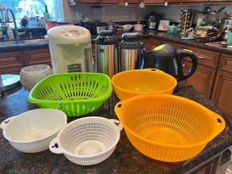 Three different sizes of plastic strainer colander