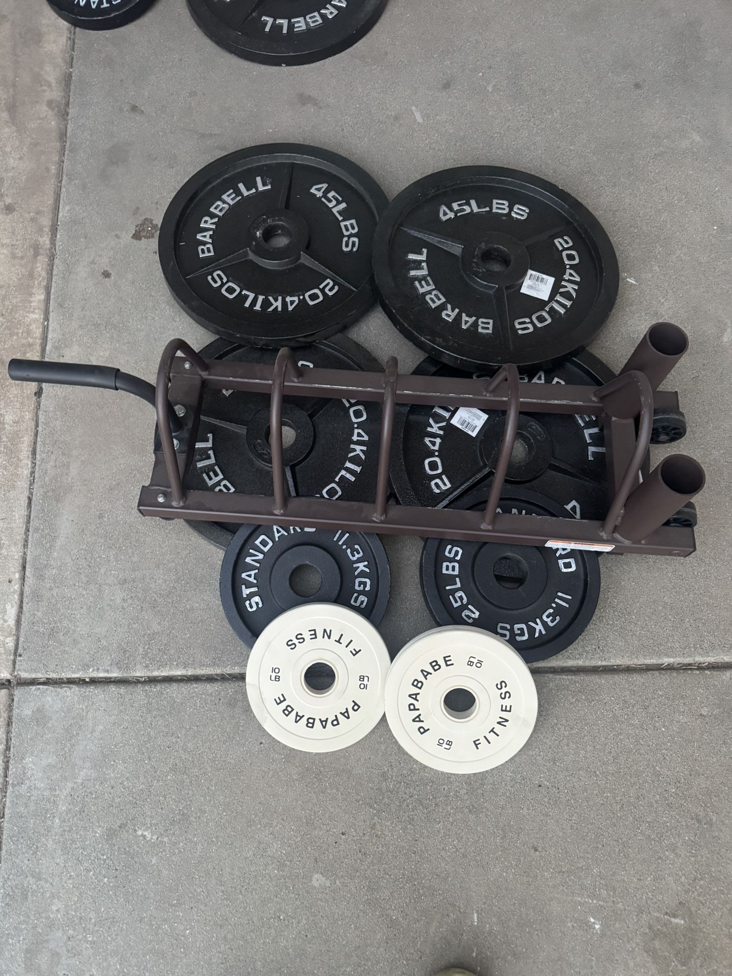 250lbs of Olympic weights with weights tree