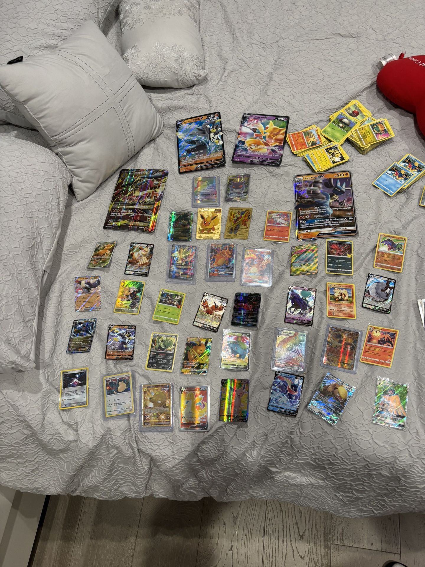 Pokémon cards with sleeve holder,tins,barcodes,metal pokeball, and coins
