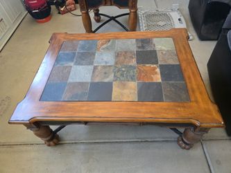 Wood coffee table and end table with tile tops.