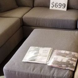 Brand New 104" x 75" Reversible Sectional + Ottoman