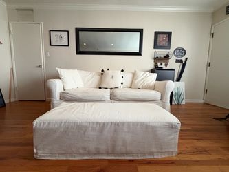 White Slipcovered Sofa and Ottoman Set