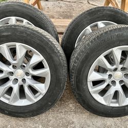 4 OEM factory wheels and tires off a 2023 Chevy Silverado 1500.