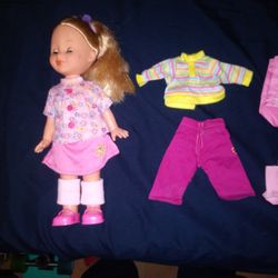 Doll With An Extra Outfit And Hand Bag