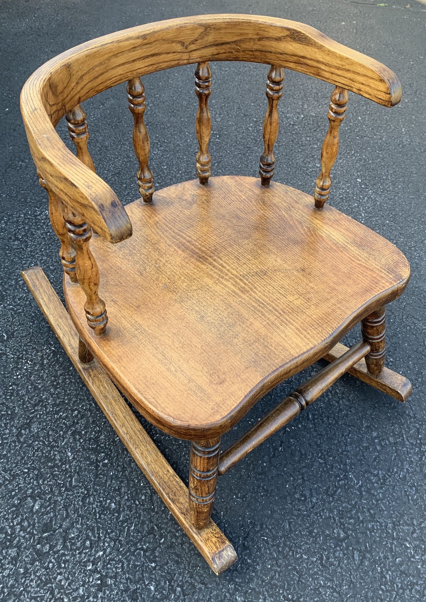 Antique, wooden, toddler-size rocking chair.