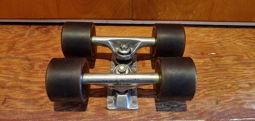 Long board trucks with wheels