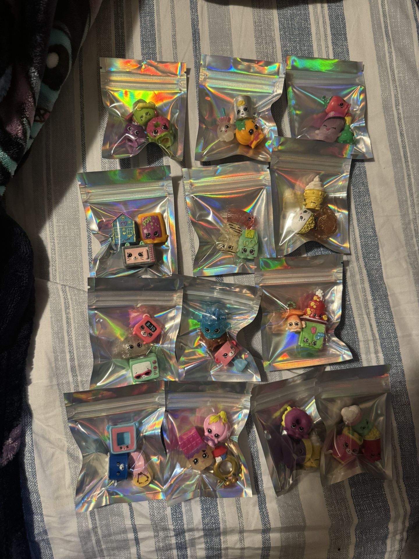 Lots of mini shopkins figures 3 of them come in the small bag for $5 each few bags available msg me